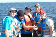Students with a fish at the Drexel Environmental Science Academy